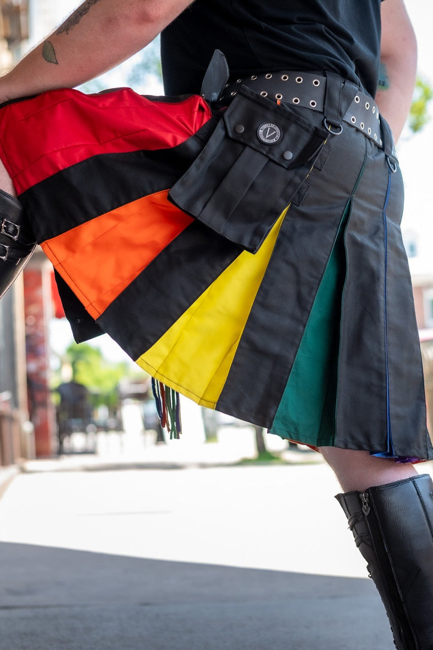 Person wearing a colorful kilt with a blurred background